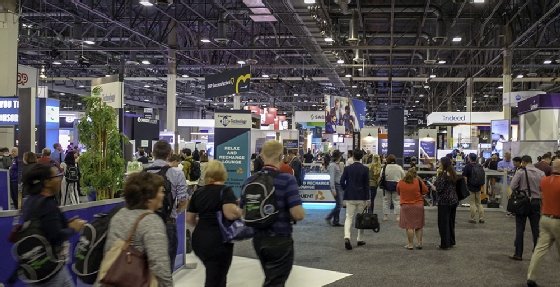 Attendees walk through the expo area at the 2018 HR Technology Conference