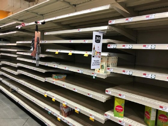 Empty Whole Foods shelves