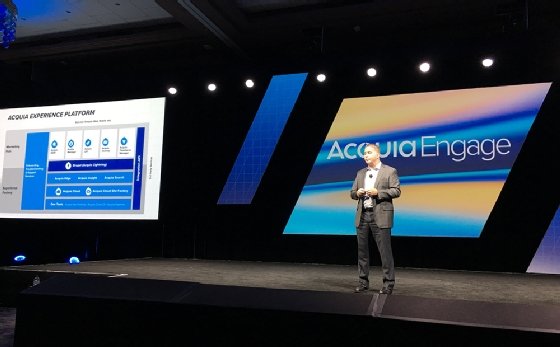 Photo of Acquia CEO Michael Sullivan presenting on stage