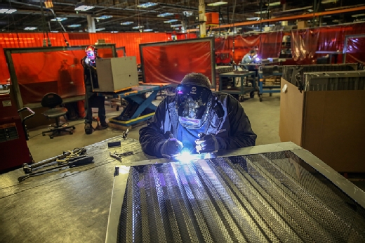 Dalsin Industries welder applies spot fix.