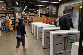 Amazon Go store with entrance and exit turnstiles