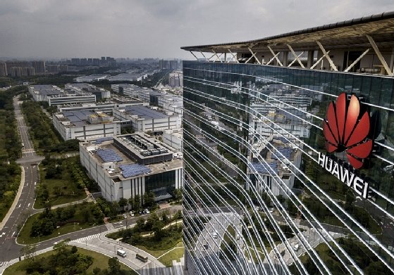 DONGGUAN, CHINA -- APRIL 25: The Huawei logo is seen on the side of the main building at the company's production campus on April 25, 2019, in Dongguan, near Shenzhen, China. 
