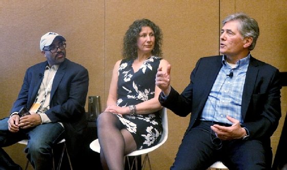 Three people, Brent Leary, Ginger Conlon and Denis Pombriant, sitting together on a conference panel