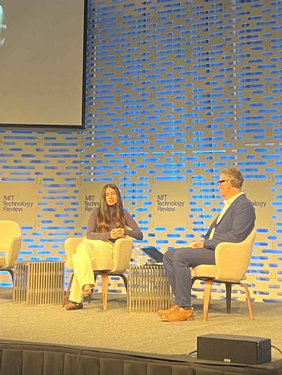 Photo of Asha Sharma and Will Douglas Heaven sitting on stage at MIT EmTech AI.