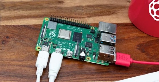 The image displays cables connecting to a Raspberry Pi 4 Model B device.