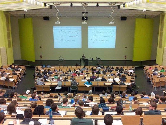 Students and their instructor during a college lecture.