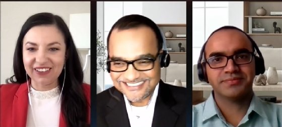 MicroStrategy's Ulyana Uebersezig (left) speaks with Crate & Barrel's Anupam Singh (middle) and Arijit Kar.