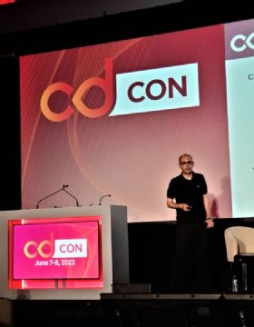 Fatih Degirmenci on stage at cdCon 2022