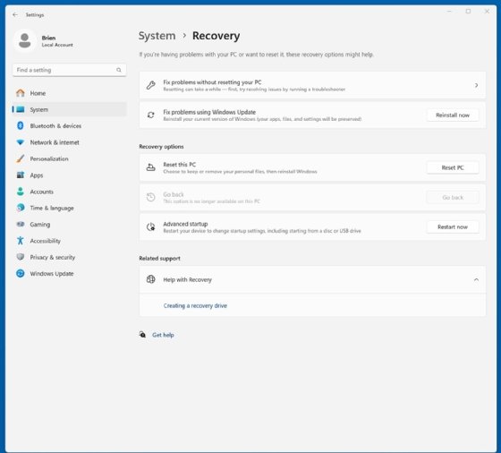 The System > Recovery window for Windows 11 has the 'Reset this PC' button.