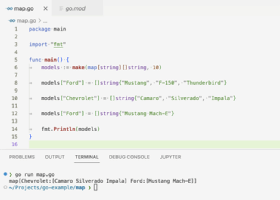 The screenshot shows the code and output of a Go program that makes a map and reassigns a new value to one of its keys.
