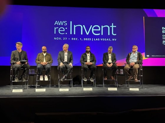 Speakers seated on stage at the AWS re:Invent 2023 healthcare panel.