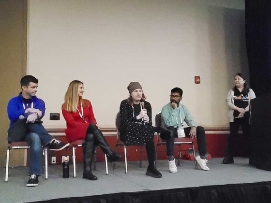 KubeCon 2024 breakout session panel participants on stage.