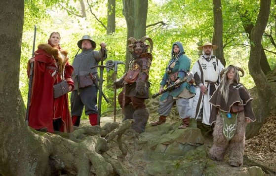 Image of costumed live-action role-players posing in a forest.