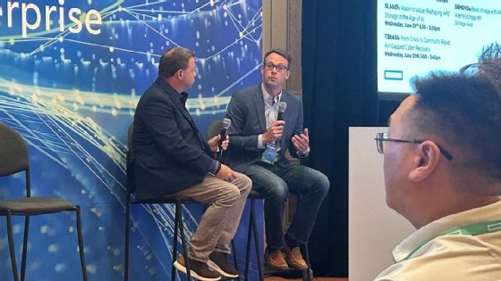 Liberty Mutual's Christopher Lund and HPE's Matt Boris speaking on stage at HPE Discover 2024.