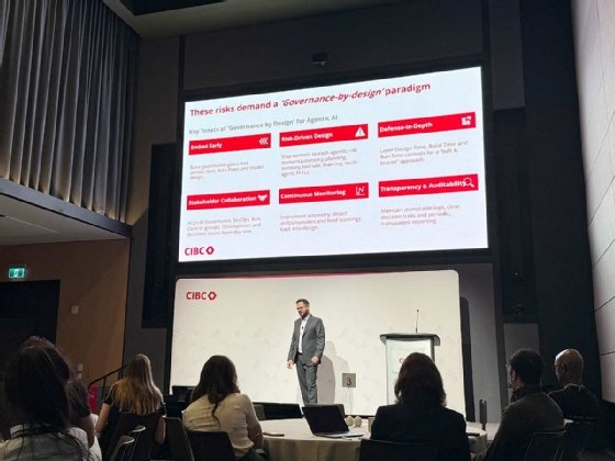 Ankit Misra stands on stage at TMLS Summit in front of a slide presentation showing the six tenets of agentic AI governance by design.