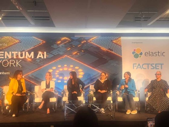 A panel of women seated on stage at the Reuters Momentum AI New York conference.