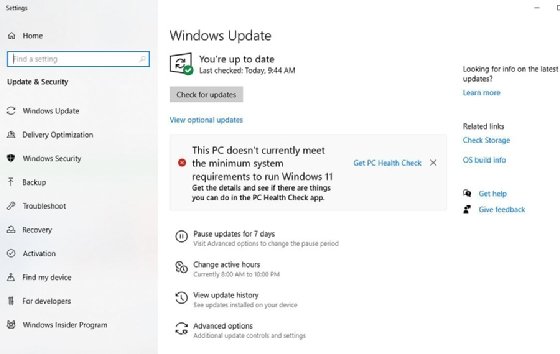 The Windows 10 Update menu shows the status of a desktop migration to Windows 11.